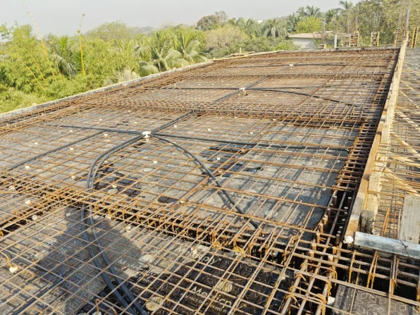 Conduit pipes laid inside the roof slab reinforcement before concreting